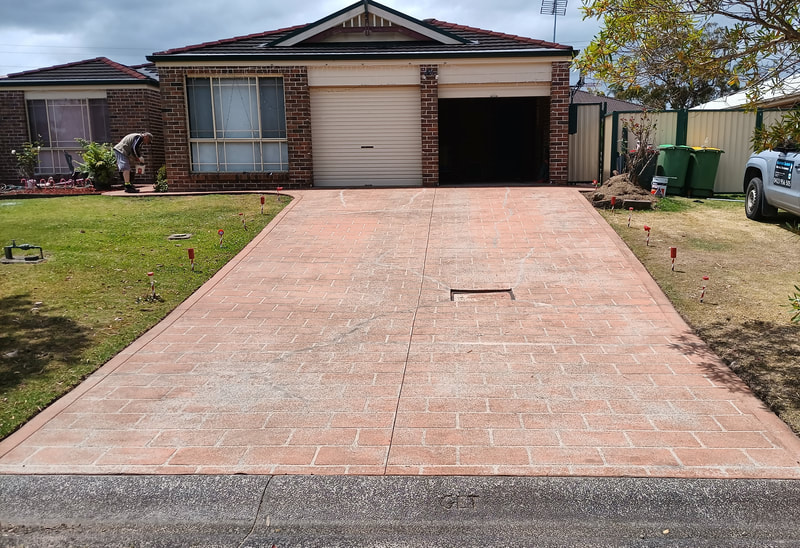 Unpainted driveway of house at Bluehaven.