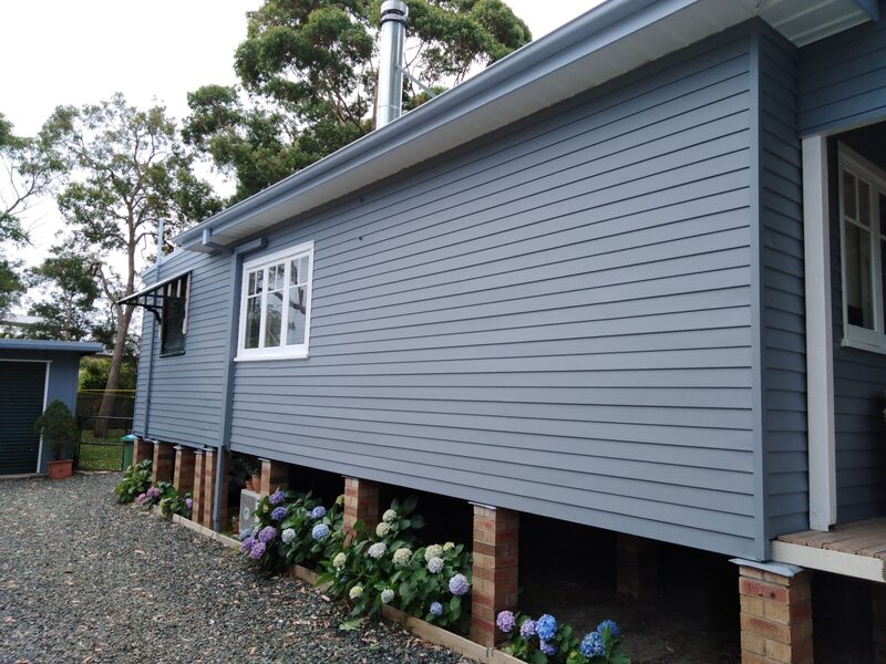 Blue and white exterior of house painted at Lake Munmorah 